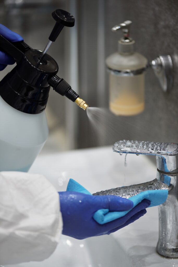 A faucet cleaned with disinfectant spray.