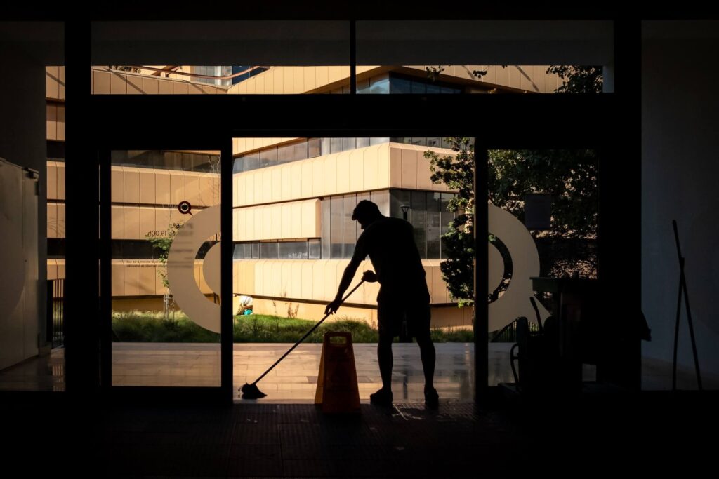 Janitor mopping floor at the entrance