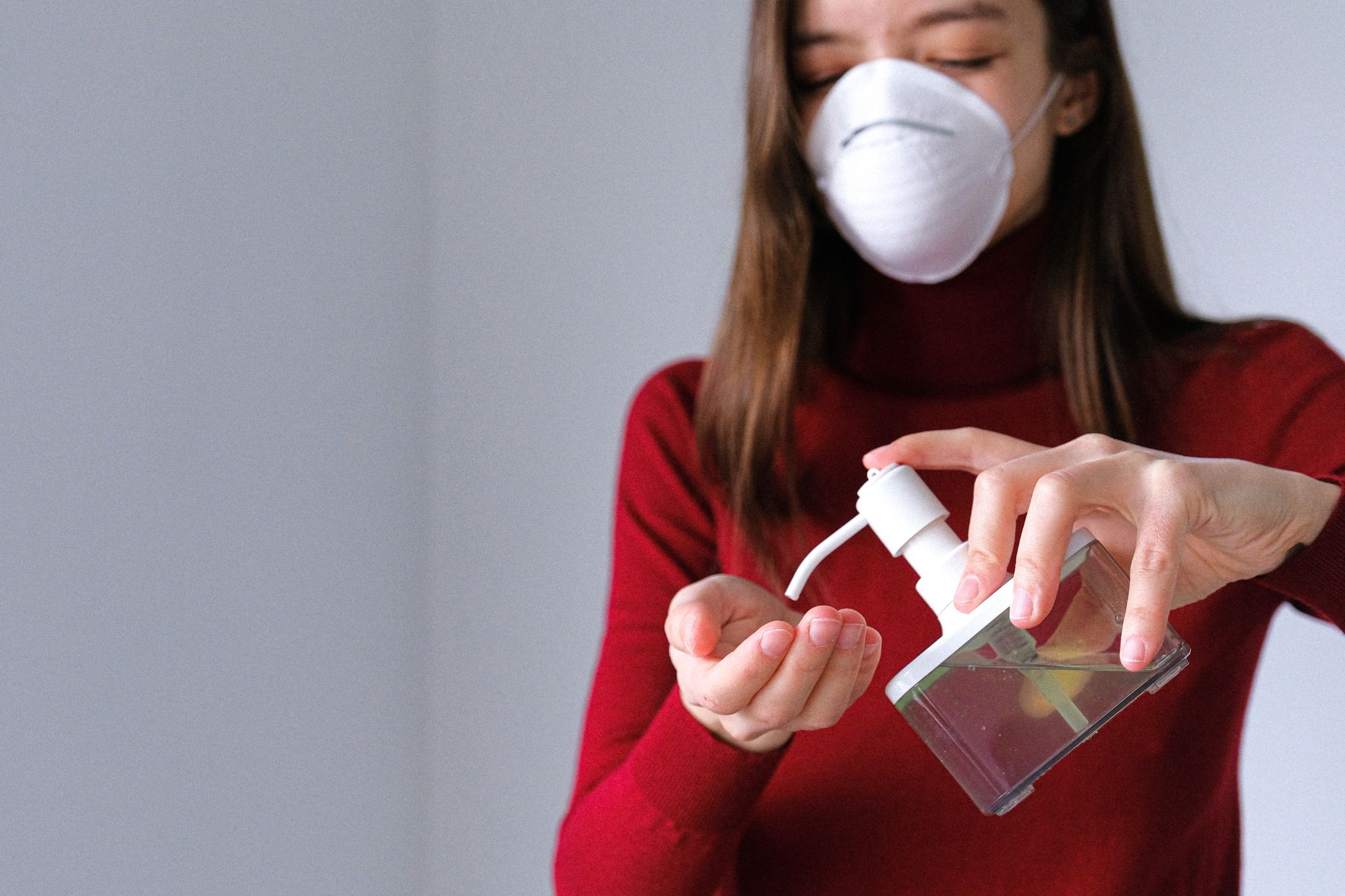 Woman Using Hand Sanitizer