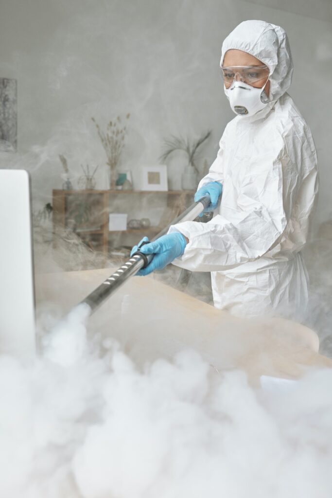 Woman disinfecting a surface