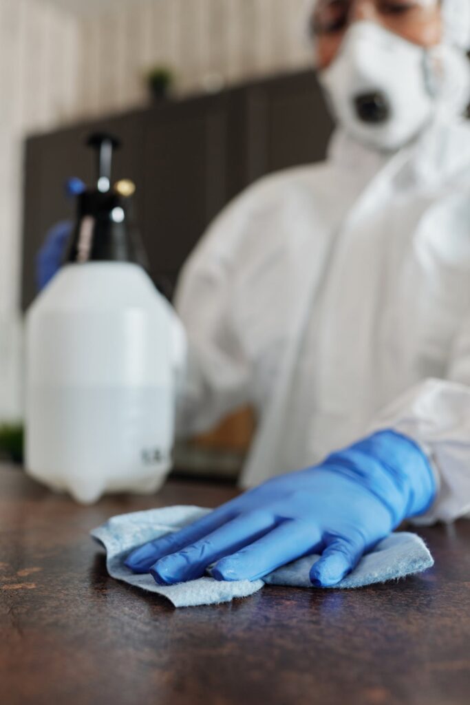 Masked Person Cleaning a Medical Office