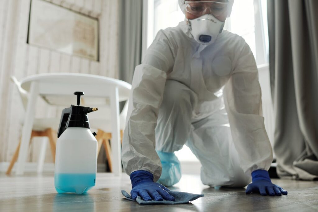 Worker scrubbing a floor