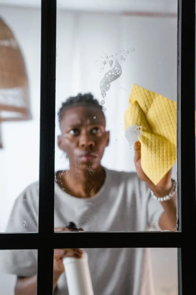 Man cleaning a window