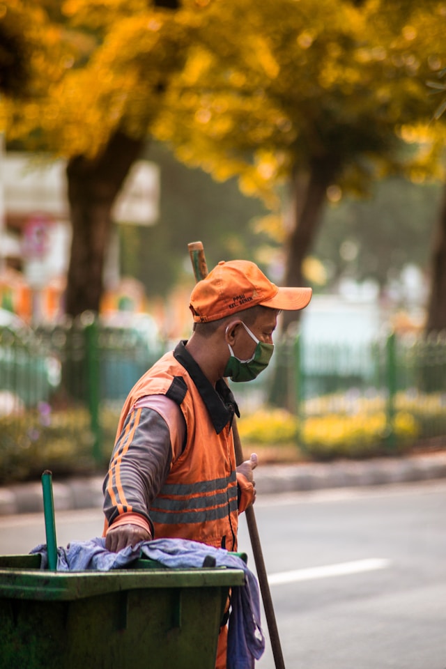 Man holding cleaning equipment outside