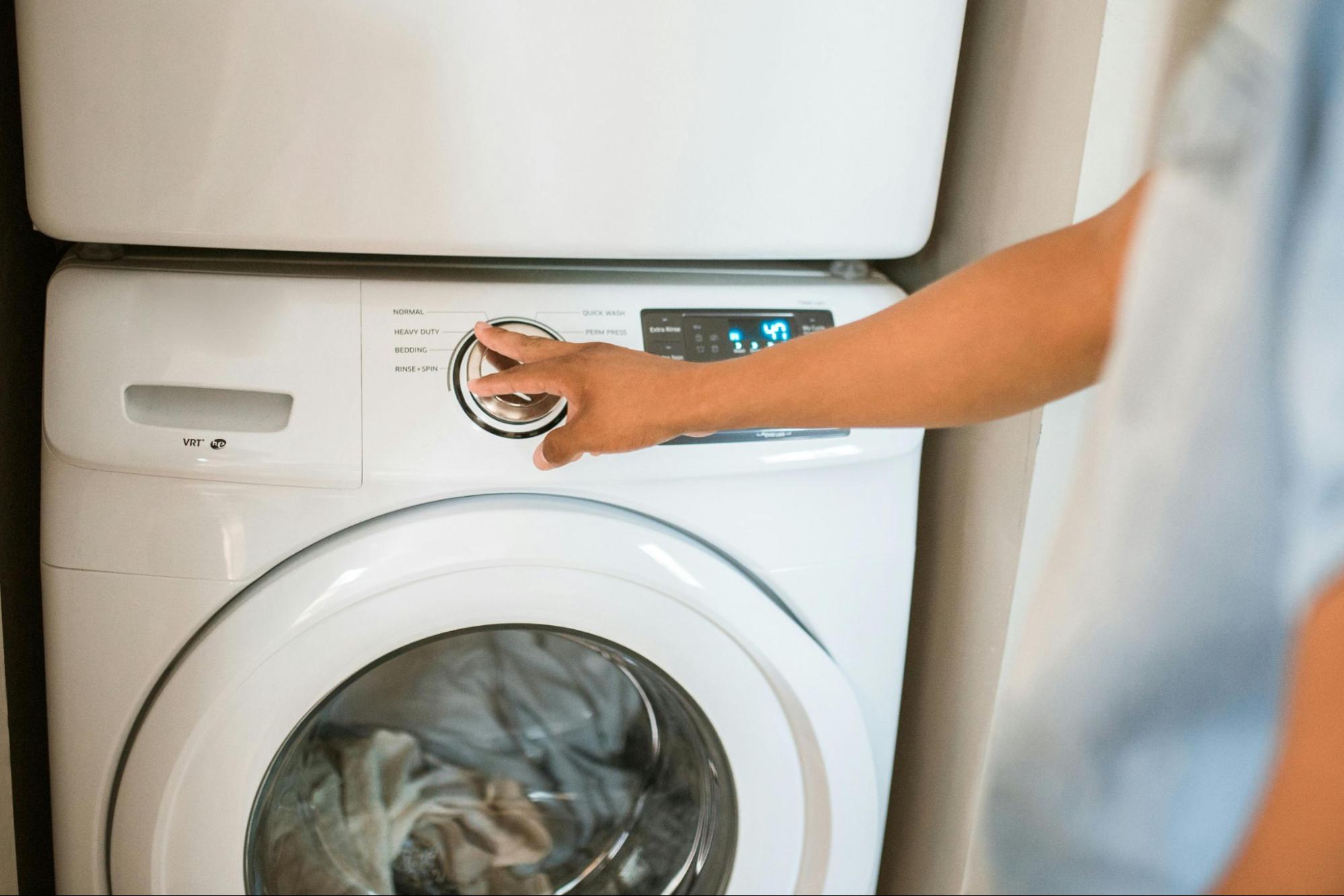 Person pressing a dryer button