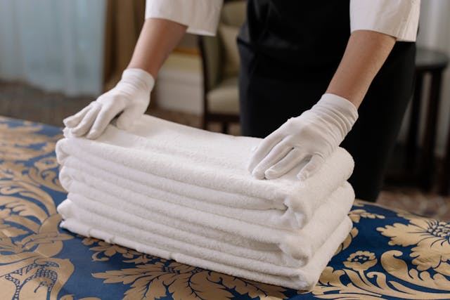 A person folding towels