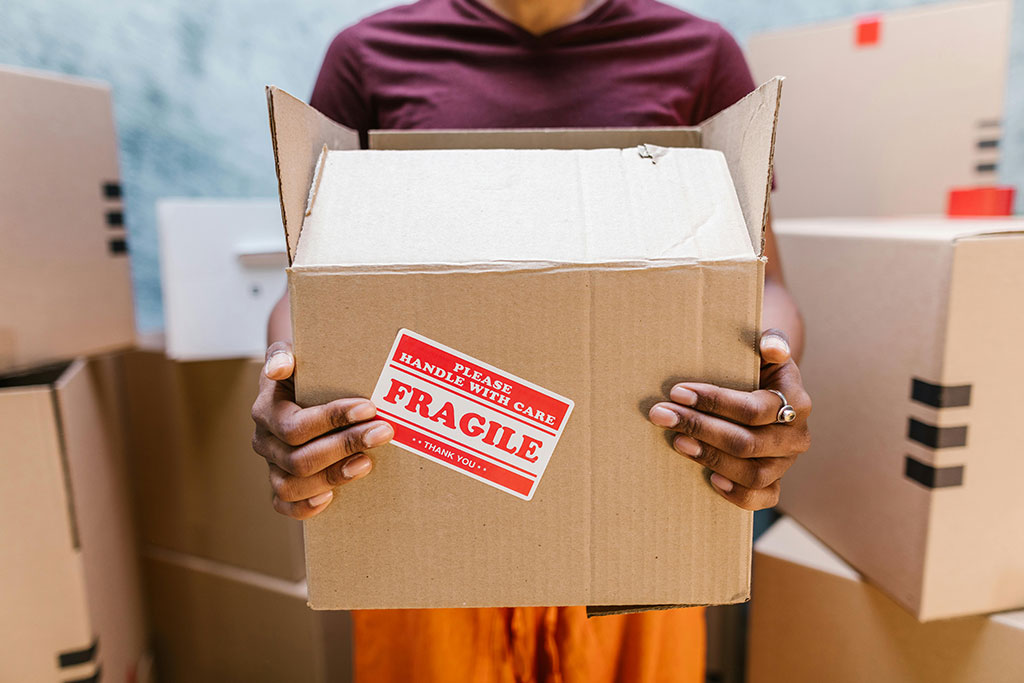 Person holding a fragile box