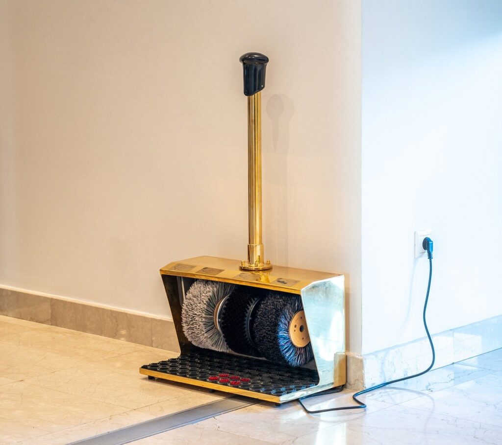 A floor cleaning machine is against the wall