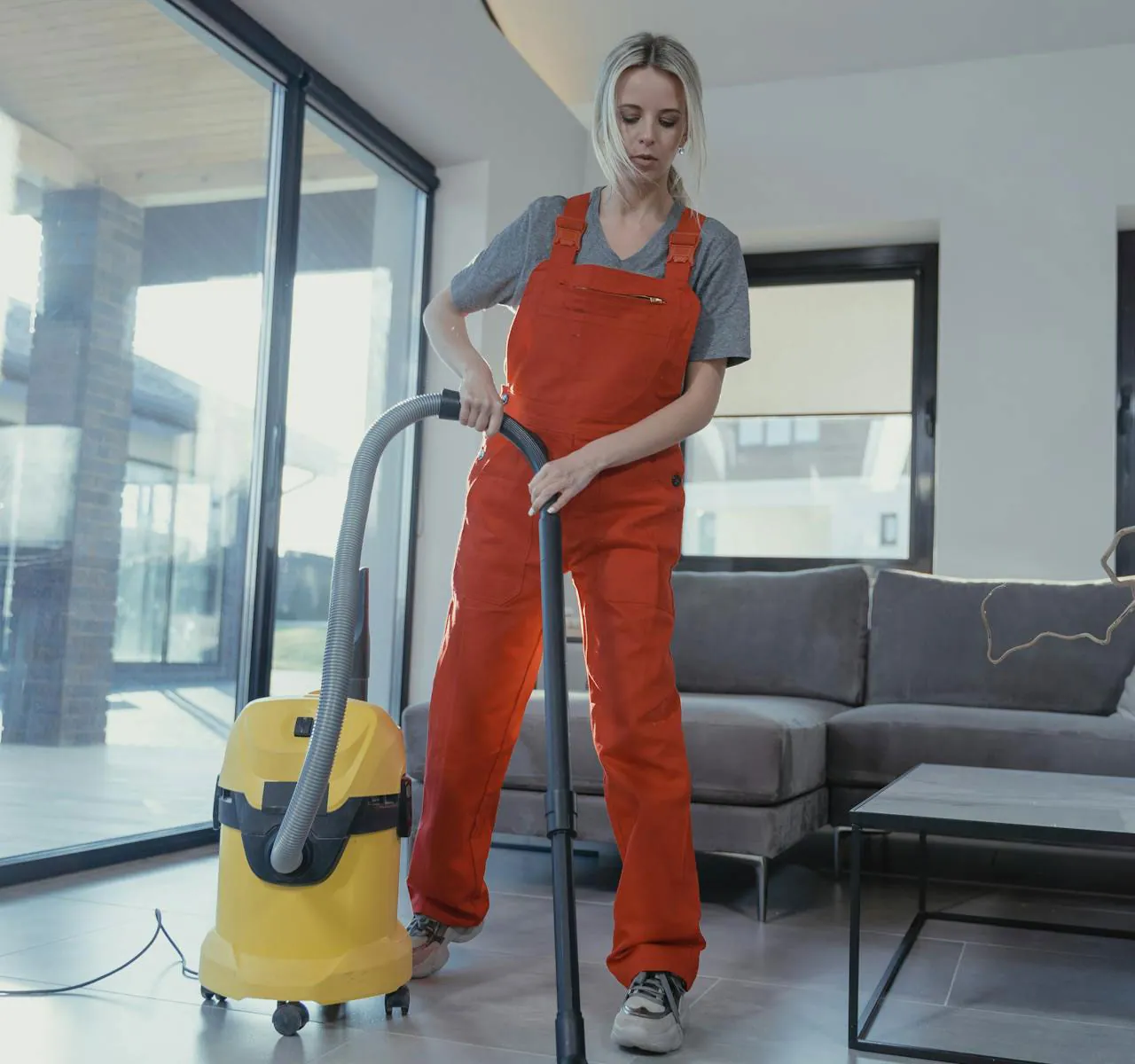 Woman is cleaning the floor