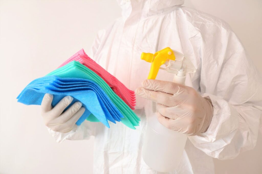Cleaner holding microfiber cloths and spray